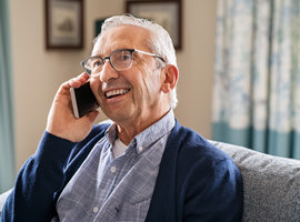 Male pensioner on mobile phone
